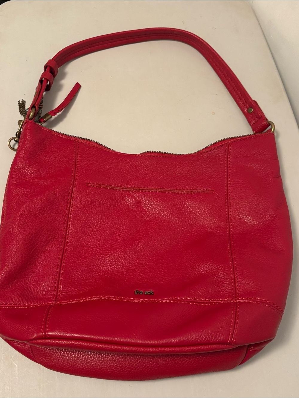 The Sak De Young Hobo Bag in a vibrant red leather.